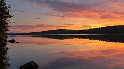 AI illustration of Sunset over Cold Stream Pond in Enfield, Maine