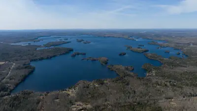 Aerial view of Meddybemps Lake and its many wooded islands in Washington County, Maine, in April 2026.