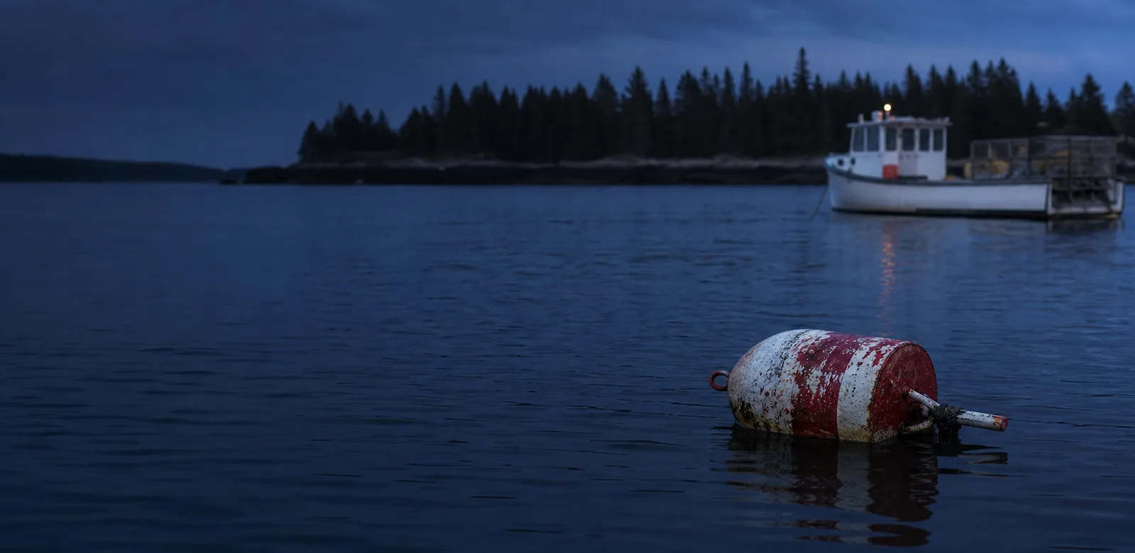 Maine fishing buoy at dusk
